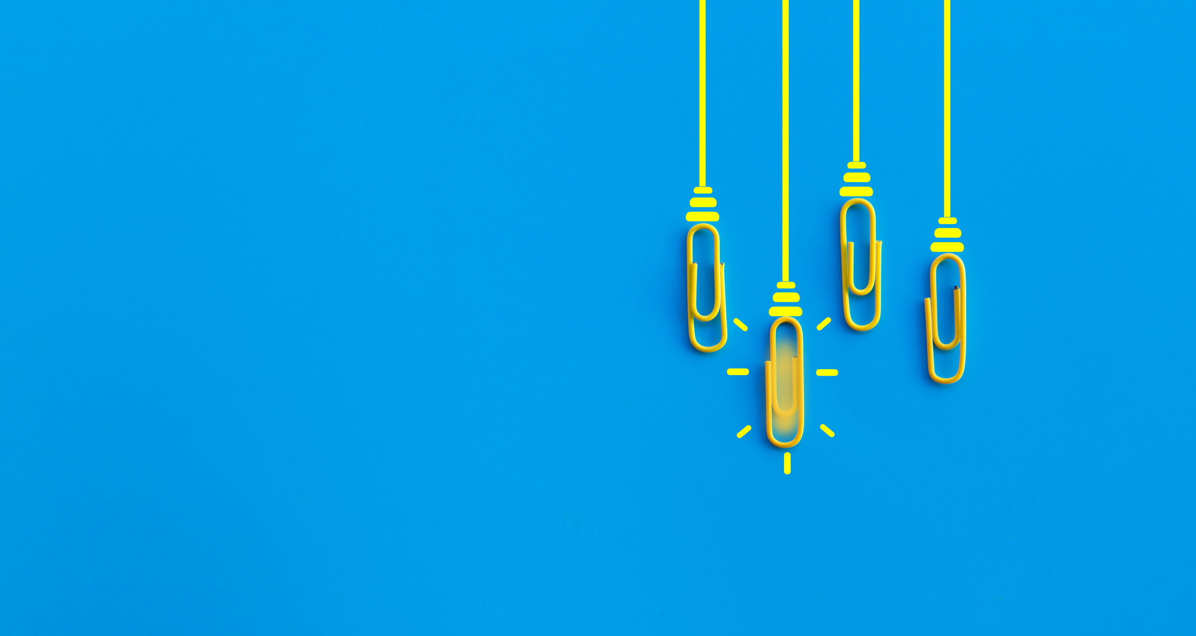 Great ideas concept with paperclip,thinking,creativity,light bulb on blue background,new ideas concept.